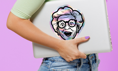 holographic sticker of a surprised grandma on the back of a laptop being carried | Stickers.com